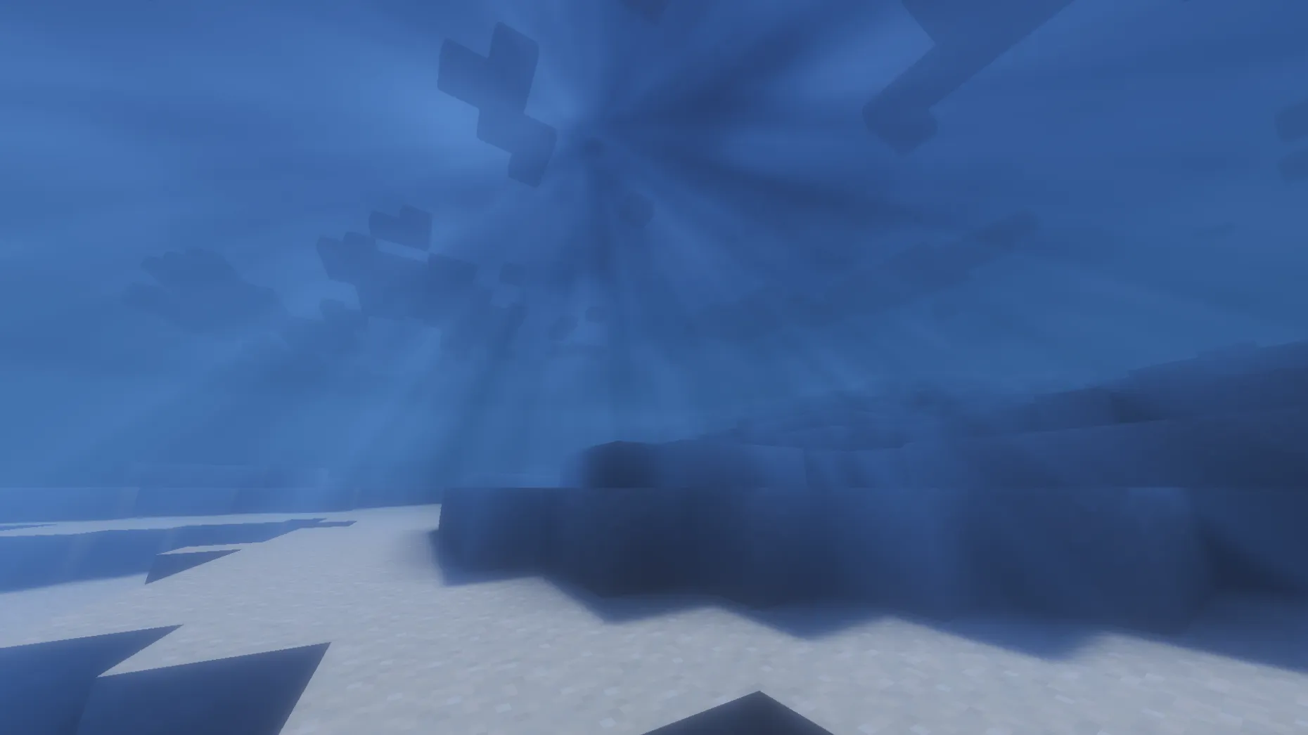 Underwater volumetric light shafts passing through the water surface